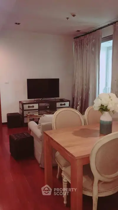 Charming living room with elegant dining set and cozy seating area
