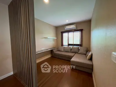 Cozy living room with sectional sofa and wooden flooring