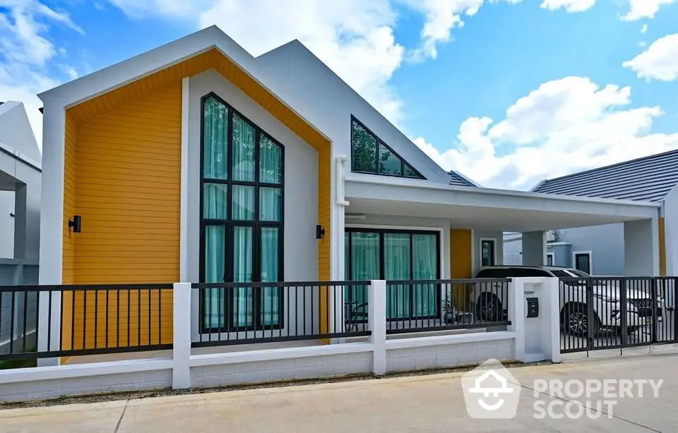 Modern single-story house with unique architectural design and large windows