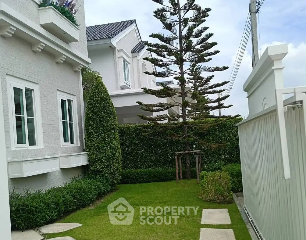 Charming suburban home with lush garden and manicured lawn