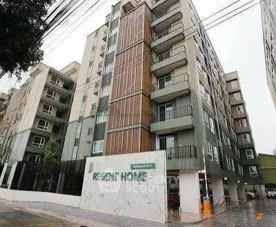 Modern apartment building exterior with balconies and contemporary design.