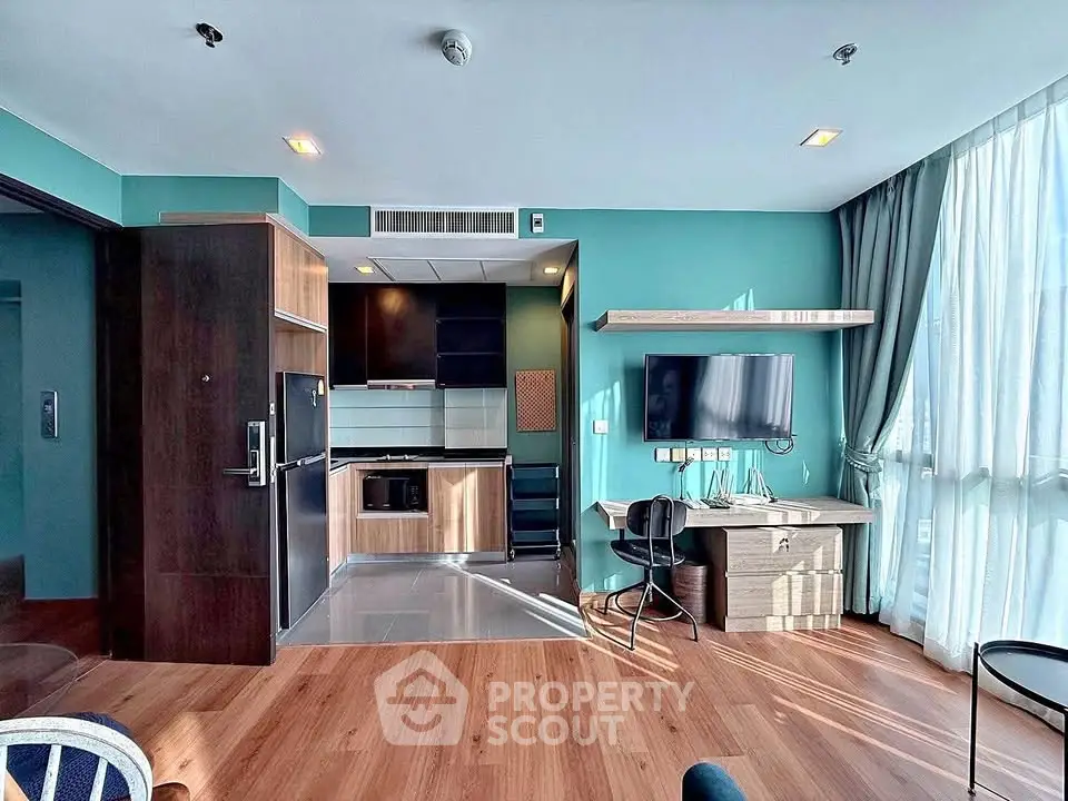 Modern living room with open kitchen and stylish decor in a bright apartment