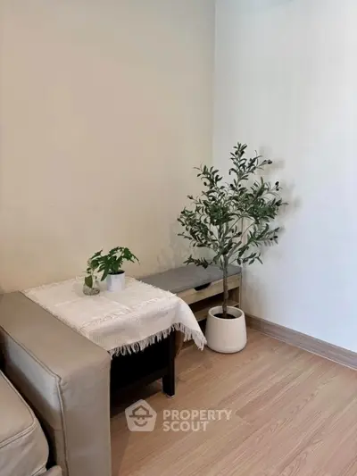 Cozy living room corner with stylish decor and indoor plants
