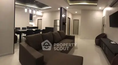 Spacious modern living room with open kitchen and stylish furniture