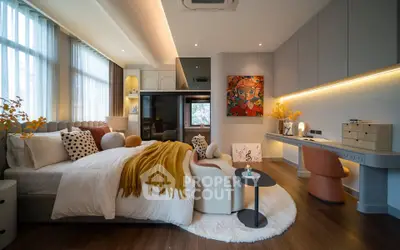 Luxurious modern bedroom with stylish decor and ample natural light
