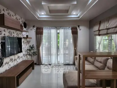 Elegant living room with modern decor and large windows for natural light.