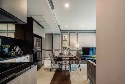 Modern open-plan living and dining area with stylish decor and elegant furnishings.