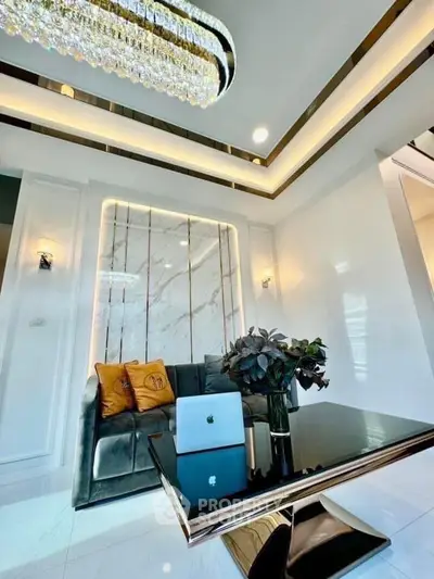 Luxurious living room with elegant decor and modern chandelier