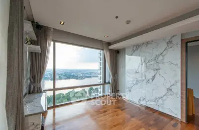 Luxurious living room with stunning river view and elegant marble accents