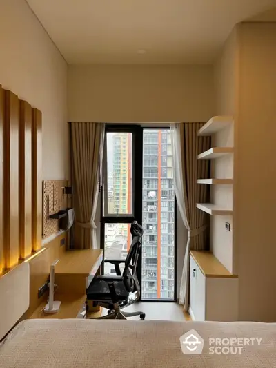 Modern study room with city view, ergonomic chair, and sleek wooden desk.