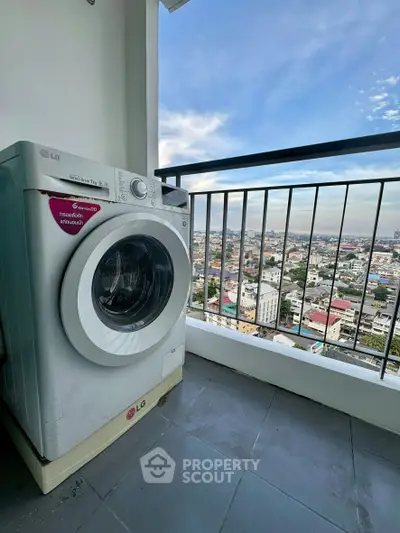 High-rise balcony with washing machine and stunning city view