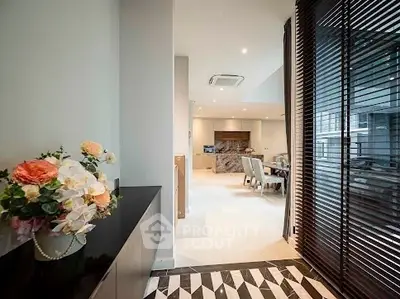 Luxurious open-plan living space with elegant dining area and modern decor