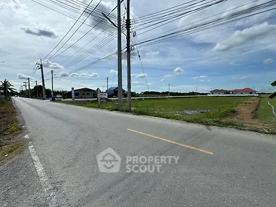 Spacious land plot with road access and scenic surroundings, ideal for development opportunities.