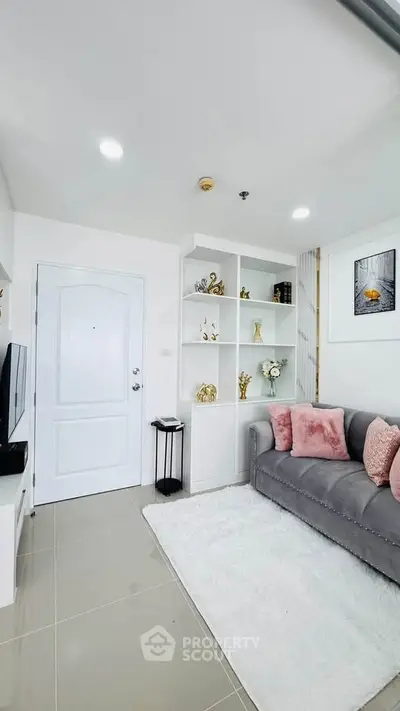 Chic modern living room with plush gray sofa and elegant decor