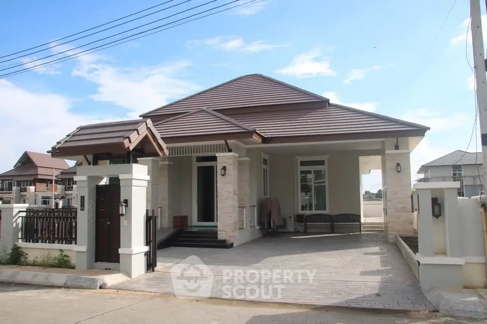 Charming single-story house with modern design and spacious driveway in a serene neighborhood.