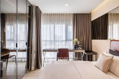 Luxurious bedroom with floor-to-ceiling windows and elegant decor