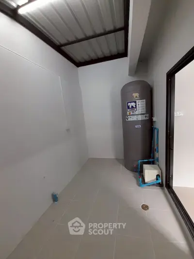 Spacious storage room with water heater in modern home