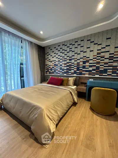 Modern bedroom with stylish decor and large window view