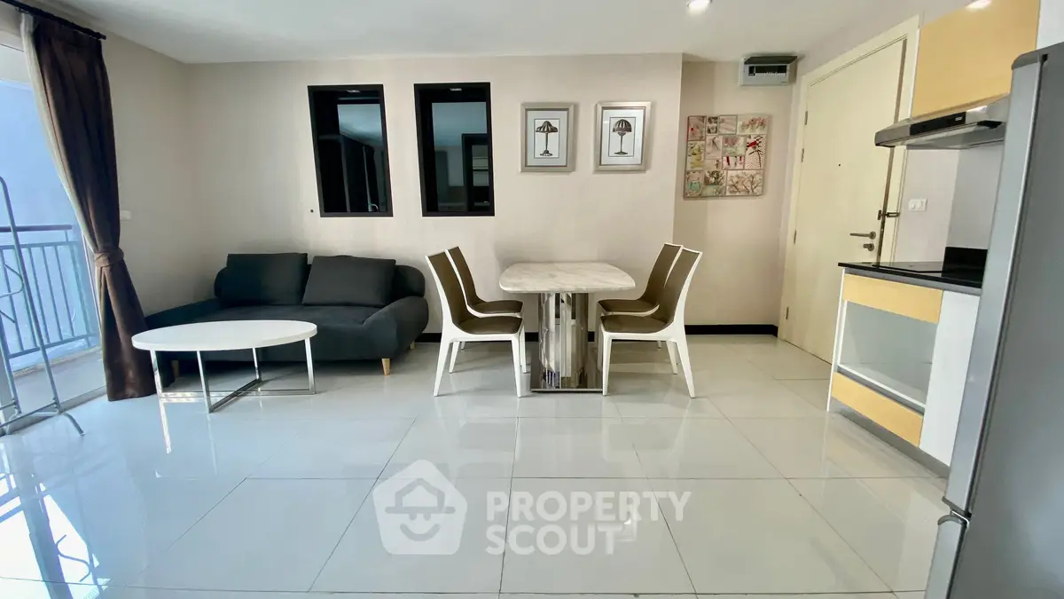 Modern living room with dining area and sleek furniture in a bright apartment