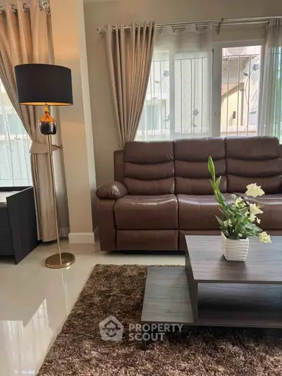Stylish living room with leather sofa and elegant decor