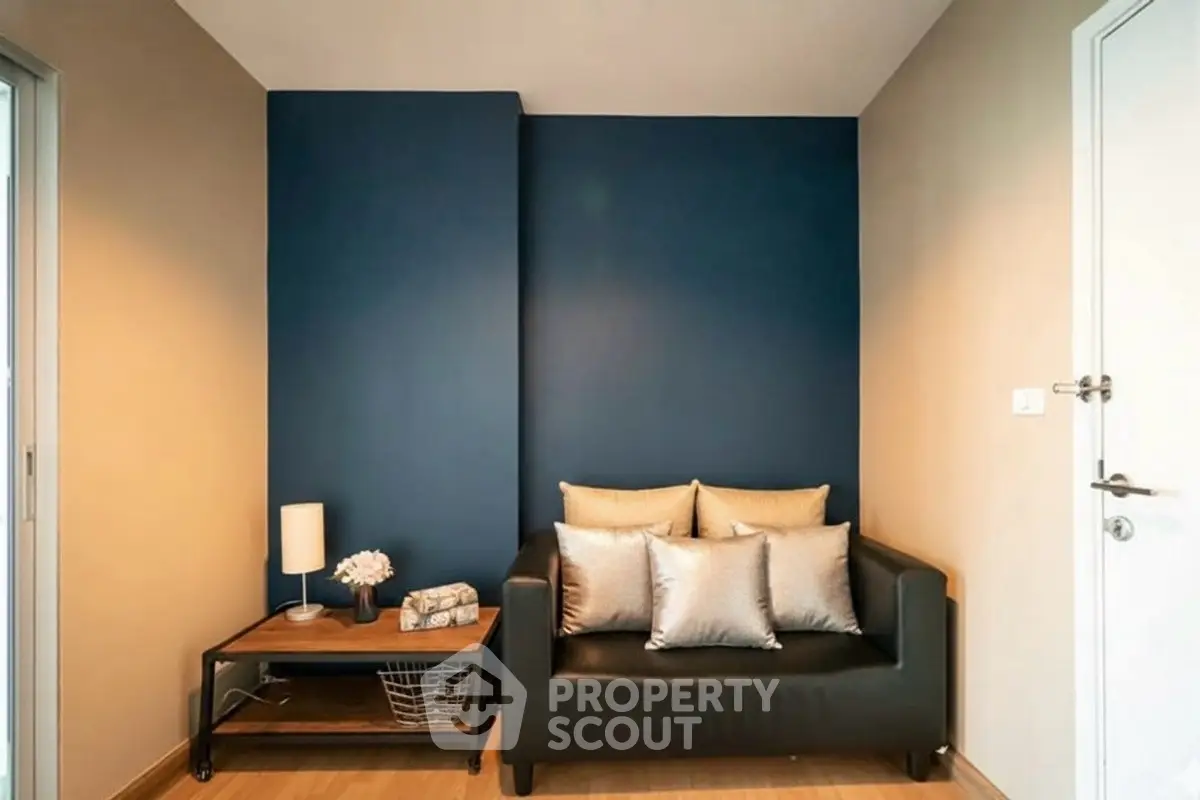 Modern living room with stylish black sofa and elegant decor