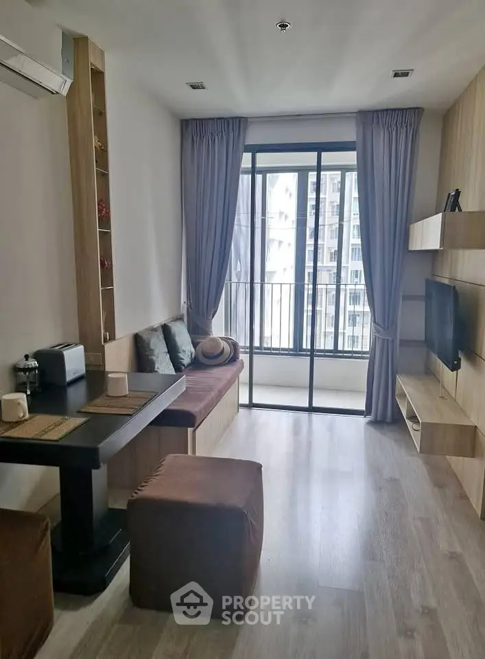 Modern living room with balcony view and stylish decor