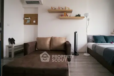 Modern studio apartment with cozy living area and stylish decor