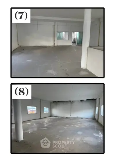 Spacious open-plan interior with large windows and columns, ideal for customization.