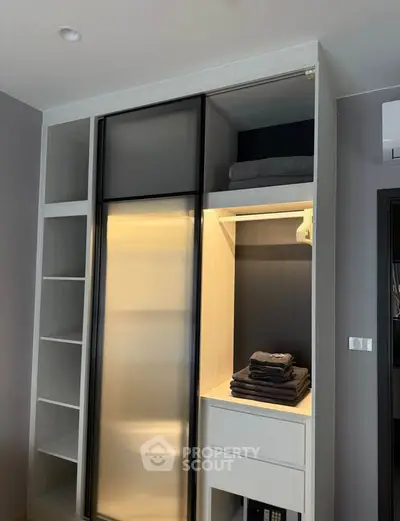 Modern bedroom closet with sleek design and ample storage space