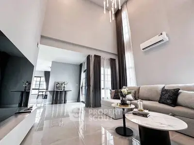 Luxurious modern living room with high ceilings and elegant decor