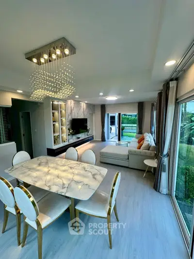 Luxurious open-plan living room with elegant dining area and modern decor