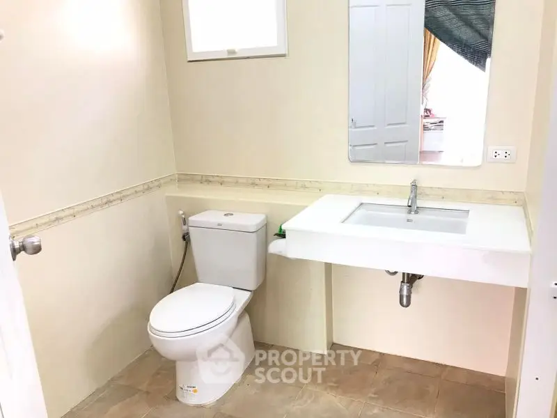 Modern bathroom with sleek fixtures and neutral tones