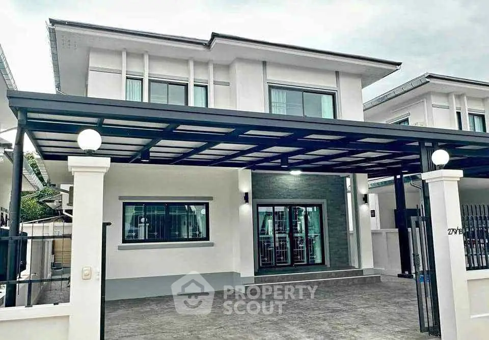 Modern two-story house with sleek design and spacious driveway