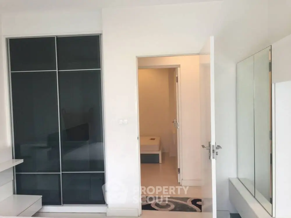 Modern interior with sleek sliding closet doors and minimalist decor