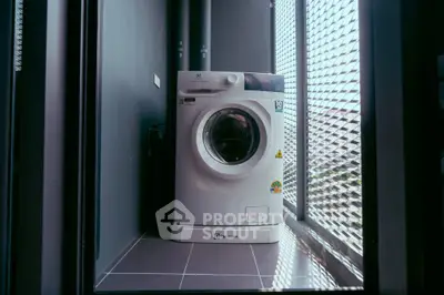 Modern washing machine in sleek balcony space with stylish design.