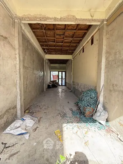 Spacious unfinished interior with high ceiling and potential for customization