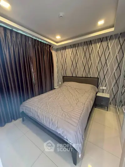 Modern bedroom with stylish wallpaper and cozy lighting