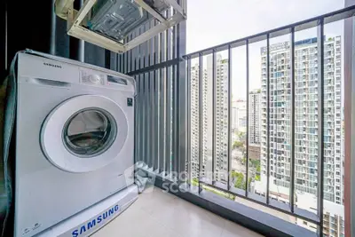 Modern balcony with washing machine and city view in high-rise apartment