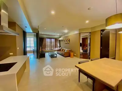 Spacious modern living room with open kitchen and stylish decor