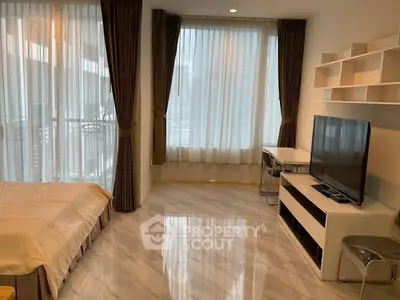 Spacious modern bedroom with large windows and stylish decor