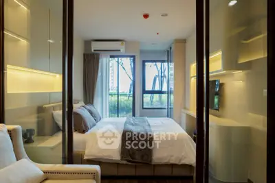 Luxurious modern bedroom with large windows and elegant decor in a high-end apartment.