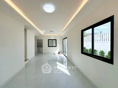 Spacious modern living room with sleek design and ample natural light