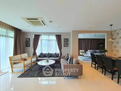 Spacious modern living room with elegant decor and ample natural light