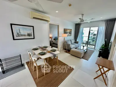 Modern living room with dining area and balcony view in stylish apartment