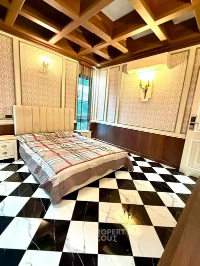 Luxurious bedroom with elegant coffered ceiling and checkered marble flooring