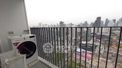 High-rise balcony with city view and washing machine