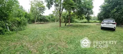 Expansive lush green lot offering a serene and private setting, ideal for constructing a dream home or a getaway retreat amidst nature.