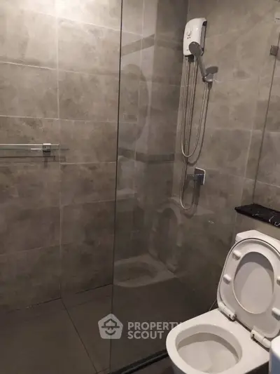 Modern bathroom with glass shower and sleek tile design