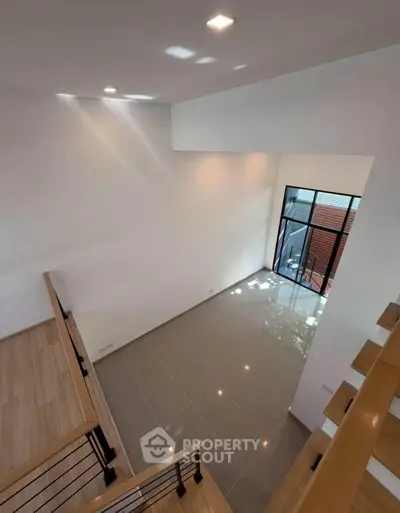 Spacious modern interior with high ceiling and large windows