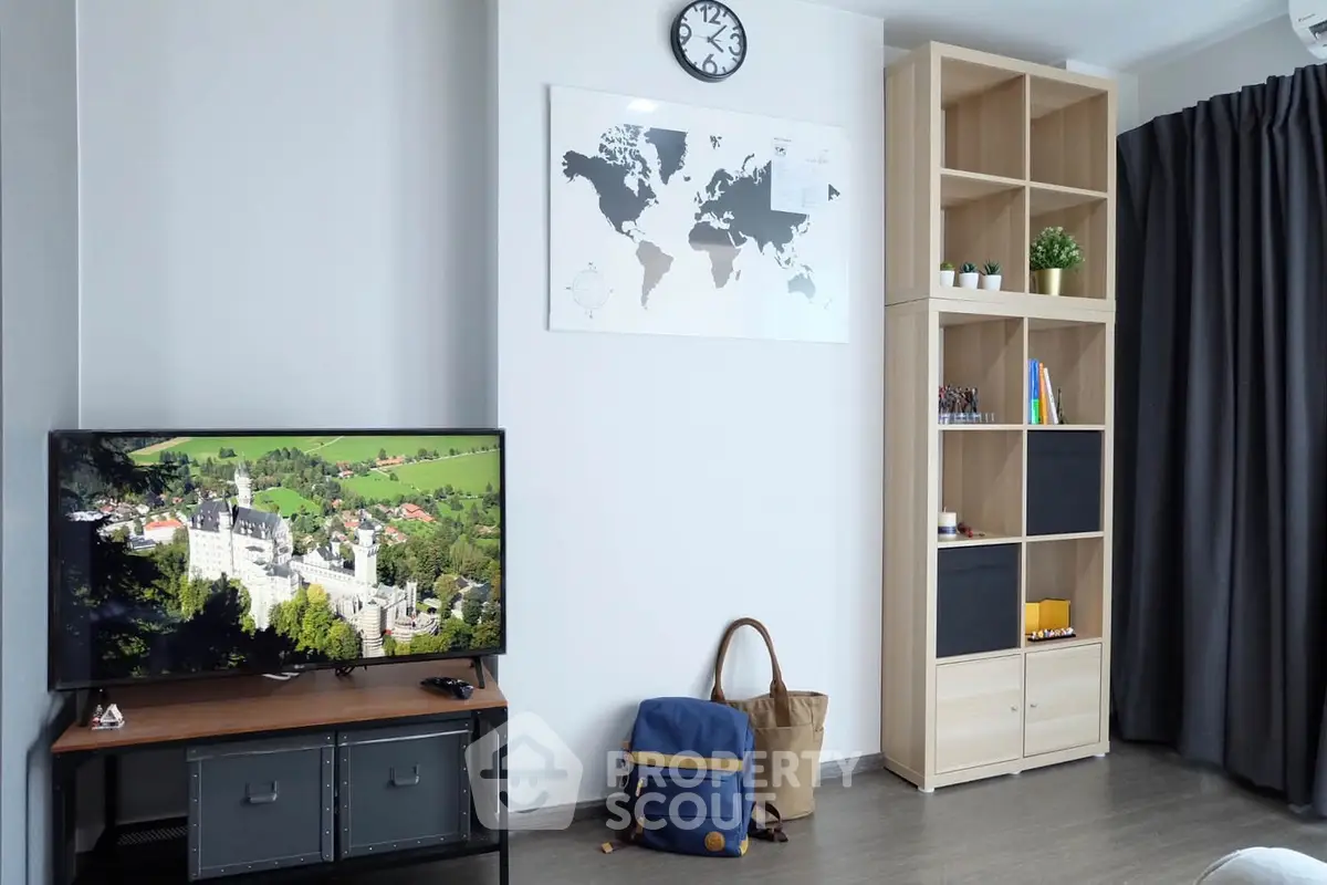 Modern living room with stylish shelving and wall-mounted TV, perfect for cozy relaxation.